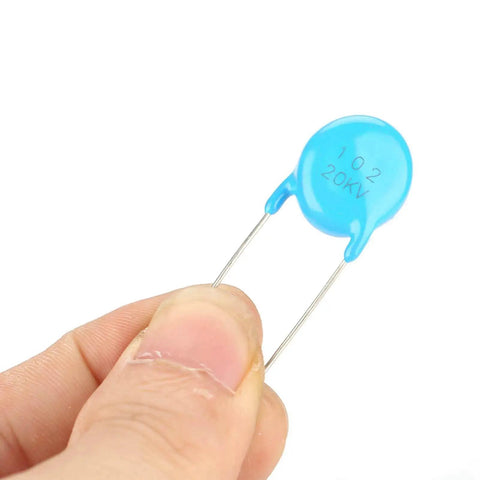 Heavy Duty High Voltage Ceramic Capacitor Value Pack Badass Electronics Project Material Tough As Nails Build For Wild Circuit Repairs Featuring Solid 20kV Power And Reliable Nanofarad Specs Just Works held in a hand.