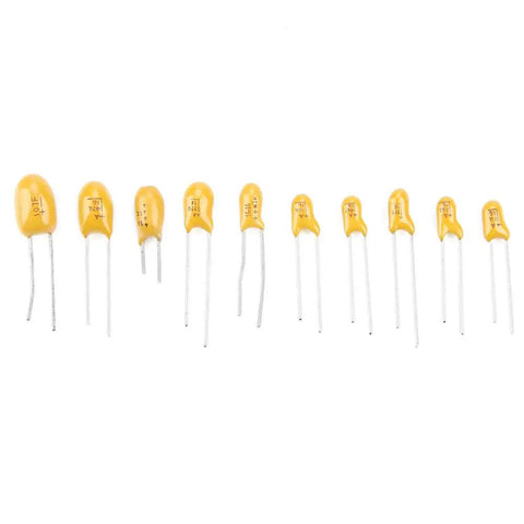 Badass Tantalum Capacitor Assortment Kit Featuring Ten Value Variations In A Nifty Labeled Storage Box, showcasing yellow tantalum capacitors.