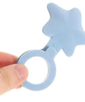 Hand holding a blue silicone star shaped bathtub stopper flat cover for drain plug, featuring a secure design.