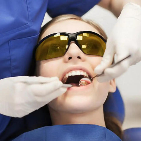 Premium Red Light Therapy Glasses With Wraparound Side Shields For Superior Eye Protection During Tanning And Laser Hair Removal Sessions That Straight Up Hits Different worn during dental procedure