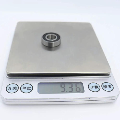 6900RS Deep Groove Ball Bearing 10 Pack Double Rubber Sealed 10X22X6MM on digital scale showing weight of 9.36 grams.