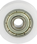 Four Pack V Groove Bearing Pulleys Featuring Rock Hard Metal Rollers Wrapped In Beefy Nylon Wheels For A Slick Glide On Linear Rail Tracks Measuring Four Millimeter Bore By Eighteen Outer Diameter By Six Thick To Lock In Your Build, showing a close-up of a nylon wheel with a metal bearing.