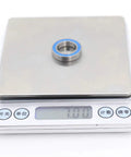 10 Pack Workhorse Chrome Steel 6802RS Ball Bearings 15x24x5mm displayed on scale for precise weight measurement.