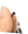 Close-up of black screw from 18 Piece Small Screw Set With Flat Countersunk Head Fasteners For Glasses And Watches Diy Projects