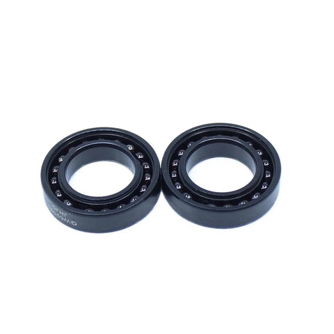 Tough High Temperature Ball Bearings Set Of Two Precision 6906 Size 30 By 47 By 9 Millimeter with black cast iron housings.