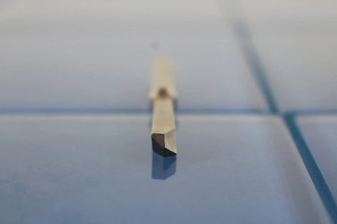 Close-up of a quarter inch solid carbide drill extractor for broken taps and damaged bolts with self centering point, straight flutes.