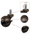 Close-up of Vintage Brass M11x20 Stem Caster 2 Inch swivel ball wheel for smooth gliding DIY furniture projects.