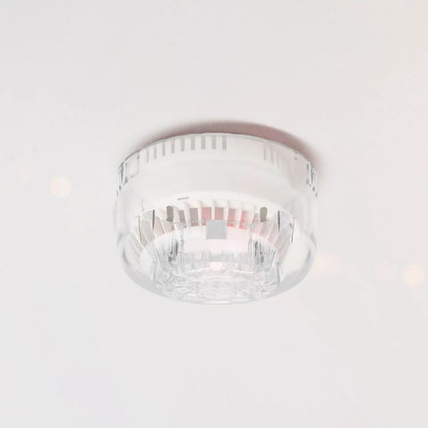 Slick One Hand Smoke Sensor Removal Tool Head Replacement Accessory With Quick Pop Mechanism For Fire Alarm Detachment and Ceiling Maintenance Work Keeping Your Crew Moving Smoothly, clear extractor head attached to ceiling smoke alarm.
