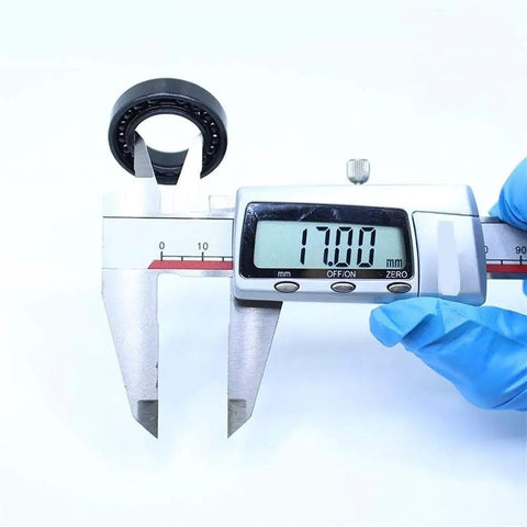 Rock Solid 2Pc High Temp Thin Section Bearings 6903 17X30x7mm measured using caliper showing 17mm diameter.