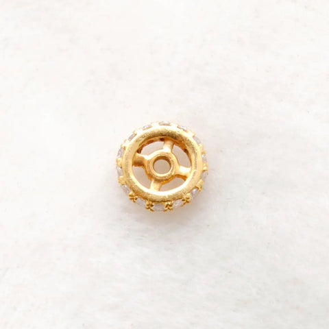 Next Level 8mm 14K Solid Yellow Gold Pave Diamond Rondelle Spacer Bead For Diy Jewelry Crafting viewed from the top on a soft surface.
