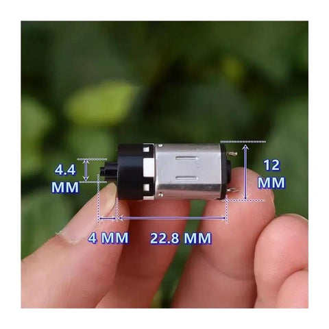 Top Rate N20 Micro Planetary Gearbox With 6 VOLT Direct Current Power Delivering A Slick 12mm Cross Shaft Cruising Chill At 117Rpm Straight Up Dope Gear For Diy Robot Cars And Home Automation Projects That Run Smooth As Silk Daily, shown in hand for size comparison.