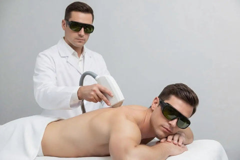 Pro Grade Laser Safety Glasses For Hair Removal To Shield Your Peepers From 755 808 And 1064 Nm Waves With Darn Good Eye Protection That Hits The Spot During Any Salon Session, used during a laser treatment on a man.