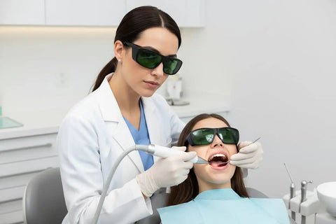 Top Shelf Dental Laser Safety Glasses Featuring Low Green Tint And Heavy Duty High Od Shielding Ultra Lightweight Protective Gear Crafted Smooth For Diode Practitioners And The Daily Clinic Grind worn by dental staff during treatment.