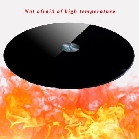 Heavy Duty Tempered Glass Rotating Serving Tray With Premium Steel Bearings above flames showcases heat resistance and sleek design.