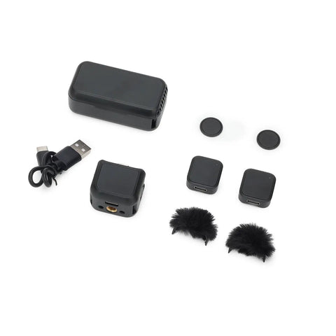 Dual Wireless Microphone Kit Featuring Portable Magnetic Lavalier Design With Snappy Plug Play Setup And Top Tier 24 Bit Audio, black components with USB and windshields.