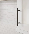 Top Shelf Pro Modern Oil Rubbed Bronze Cabinet And Drawer Pulls on white cabinet, 7 3/8in length, sleek design.