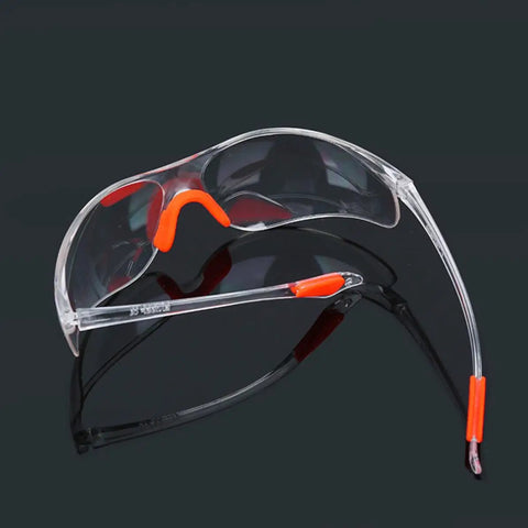 Rugged 4 Piece Set Of Anti Fog Safety Glasses featuring clear polycarbonate shields and orange silicone gaskets for workshop use.