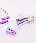 Clear Rainbow Acrylic Stapler And Staples Remover Set For Your Desk Stainless Steel Rod Sleek Executive Style Durable ABS Build A Must Have Desk Gadget For Home Office And Busy Workdays on a white surface
