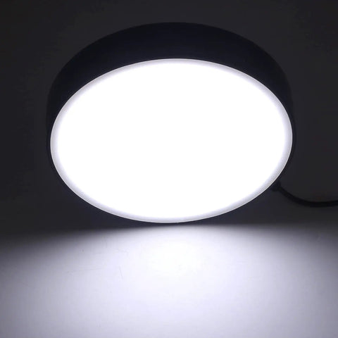 Pro-Grade Microscope LED Ring Light With 0-100% Dimming And Adapter for high CRI illumination, shown lit in a dark room.