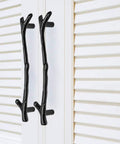 Snag This Solid 10 Pack Black Twig Drawer Pulls For An Instant Cabinet Makeover Heavy Duty Zinc Alloy Handles feature two twig handles on a white cabinet.