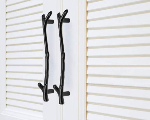 Snag This Solid 10 Pack Black Twig Drawer Pulls For An Instant Cabinet Makeover Heavy Duty Zinc Alloy Handles feature two twig handles on a white cabinet.