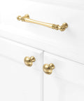 10 Pack 5 Inch Brushed Gold Kitchen Cabinet Handles And Drawer Pulls installed on white cabinet doors