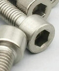 Close-up of Badass Grade 2 Beefy Titanium M6 Hex Head Bolts 75Mm Long Din912 Standard for dirt bike mounts and rig.