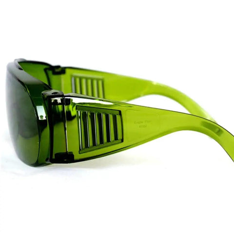 Legit Wide Spectrum Laser Safety Glasses With Kickbutt Level Eight Eye Protection And Premium Polycarbonate Shielding For Dope Industrial And Professional Projects, side view with green tinted lenses.