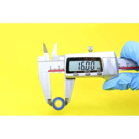 Measuring Heavy Duty Hybrid Ceramic Bearings 8x16x5mm Abec-1 with calipers showing 16mm outer diameter.