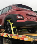 Super Tough Tow Dolly Basket Wheel Straps Lock Down Your Ride Like A Boss For 15 To 19 In Tires Beefy 10000 Pound Working Capacity Heavy Duty Nylon Car Transport Setup securing a red SUV on a tow dolly.