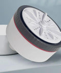 Compact Clothes Washing Machine With Kickin Double Turbo Drum That Washes Away Stubborn Marks showing the turbo agitator wheel design.