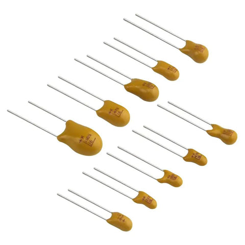 Rock Solid Tantalum Capacitor Assortment Kit Featuring One Hundred Pieces Across Ten Distinct Values Ranging From One To One Hundred Microfarads At Sixteen Volts Inside A Nifty Storage Box, showing assorted yellow capacitors.
