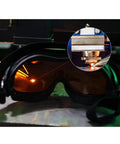Heavy Duty Laser Safety Glasses And Protective Goggles Engineered For Fiber Handheld Welding Rigs With Hella Thick OD 7 Shields on a work surface.