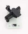 Exposed Shower System with Tub Spout 180° Rotating White faucet on a scale, showcasing modern black design and compact size.