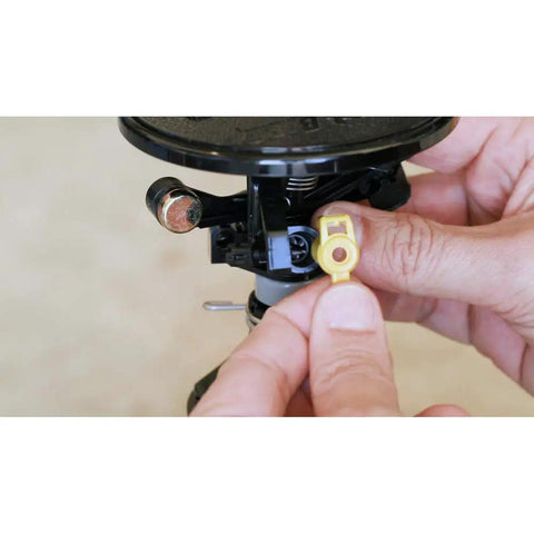 Close-up of hands installing a nozzle on the 2045A Maxi-Paw Sprinkler Bundle With All 7 Nozzles Included Heavy-Duty Impact Drive For Dirty Water