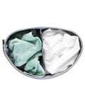 Top view of Big Ol Two-Section Laundry Hamper With Removable Inner Bags showing green and white clothes inside, 14.5 gallon. 