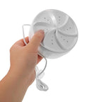 Ultra Compact Portable Mini Turbo Washer For Dorm Life And Travel Luggage With Effortless Spin Cycle held in hand, showing compact size and design.