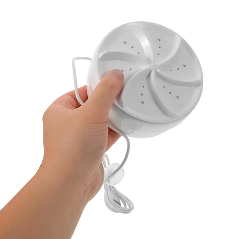 Ultra Compact Portable Mini Turbo Washer For Dorm Life And Travel Luggage With Effortless Spin Cycle held in hand, showing compact size and design.