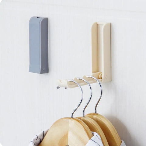 Slick Foldable Wall Hooks Self Adhesive Space Savers For Hats Bathrobes Coats Heavy Duty Peel Stick Easy Install mounted with wooden hangers.