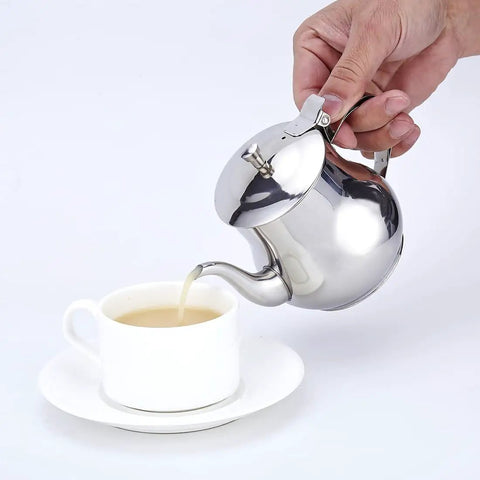 Pouring tea from Mini 360Ml Stainless Steel Teapot For Tea And More, Ultra Compact Yet Sturdy Kitchen Pot.