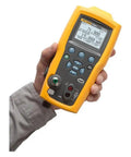 Heavy Duty Electric Pressure Calibrator With 300 PSIG Capacity And Switch Tester held in hand, displaying precise measurements and controls.