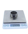 Heavy Duty Drawn Cup Needle Roller Bearing 282 By 352 By 148 Millimeters on scale showing weight 24.46 grams.