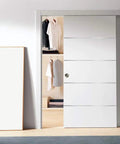 Modern White Bypass Sliding Closet Doors With Solid Core Construction And Complete Hardware Package Featuring Heavy Duty Rollers Slick Matte Finish Delivers Smooth Glide Operation For Fast Room Refresh in open position showing closet.