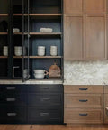 10 Pack 3 Inch Center To Center Oil Rubbed Bronze Cabinet Cup Pulls on stylish black and wood cabinets with marble countertop.