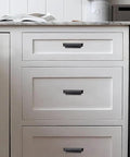 10 Pack 3 Inch Center To Center Oil Rubbed Bronze Cabinet Cup Pulls on white kitchen drawers for a stylish upgrade.