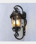 Classic Victorian Black Wall Sconce Waterproof Outdoor Porch Light Featuring E27 Edison Socket And Heavy Duty Aluminum Housing side view with illuminated glass.