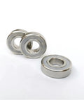 Boss Level 10 Pack S6006 RS Deep Groove Ball Bearings Built From Tough 316L Stainless Steel With Hella Waterproof Dual Seals For Zero Corrosion And Slick 30X55X13 Millimeter Smooth Riding Action, showing three ball bearings.