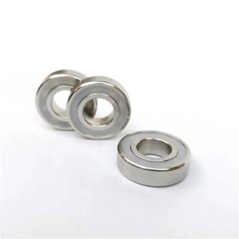 Boss Level 10 Pack S6006 RS Deep Groove Ball Bearings Built From Tough 316L Stainless Steel With Hella Waterproof Dual Seals For Zero Corrosion And Slick 30X55X13 Millimeter Smooth Riding Action, showing three ball bearings.