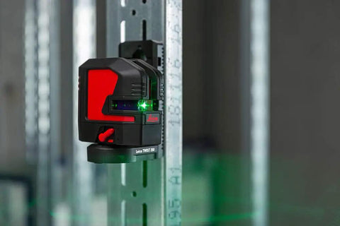 Knockout Green Beam Cross Line Laser Level For Hella Visible Layout Marks And Super Sharp Wall Grids With Effortless Drywall Tiling Setup On Tough Jobs mounted on a metal frame.