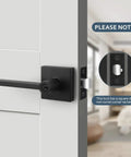 3 Pack Matte Black Door Levers With Lock And Key, installed on indoor door, square strike plate, modern design, interior view